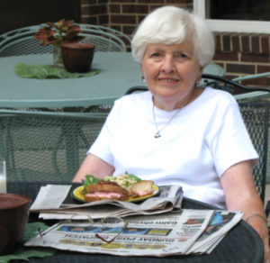 Lunch and the paper on the patio at Pacific Place Urban Senior Living